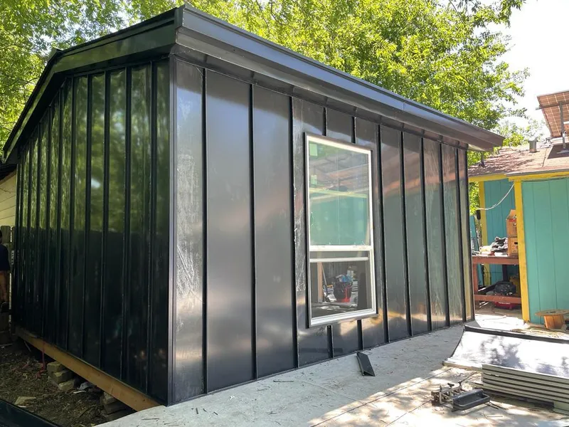 Black standing seam metal wall panels for Metal Roof Installation in Chippewa