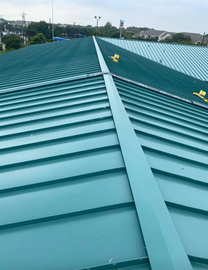 Green commercial metal roof ridge and valley for Metal Roof Repair in Chippewa